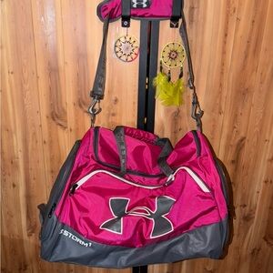 New without tags. Under Armour Fuchsia and Charcoal Travel Bag